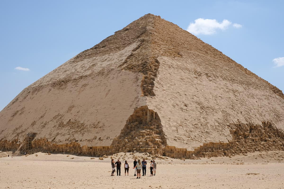 Retreat group walking through the desert of egypt with the Great Pyramid of Giza in the background