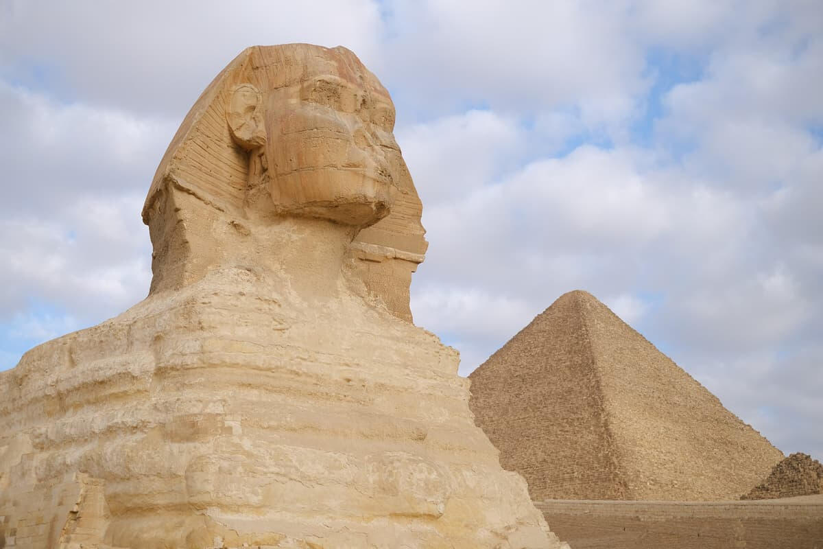 The Sphinx in Egypt with a Pyramid in the Background